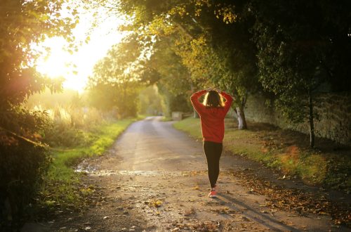 woman walking on pathway during daytime